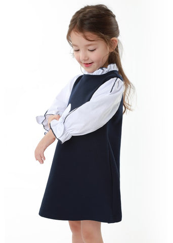 The 'High School' dress presents a polished look with its layered design. It is a girls' one-piece dress similar in style to the BB Classic. The 'High School' dress in navy color imparts a neat and refined impression.