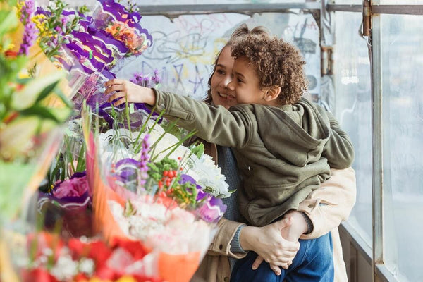 mom and son shopping flowers