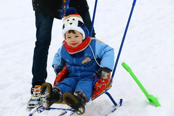 little boy sledding