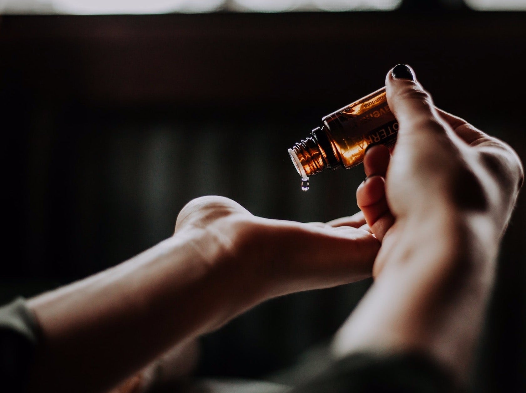 essential oil being applied to the hand