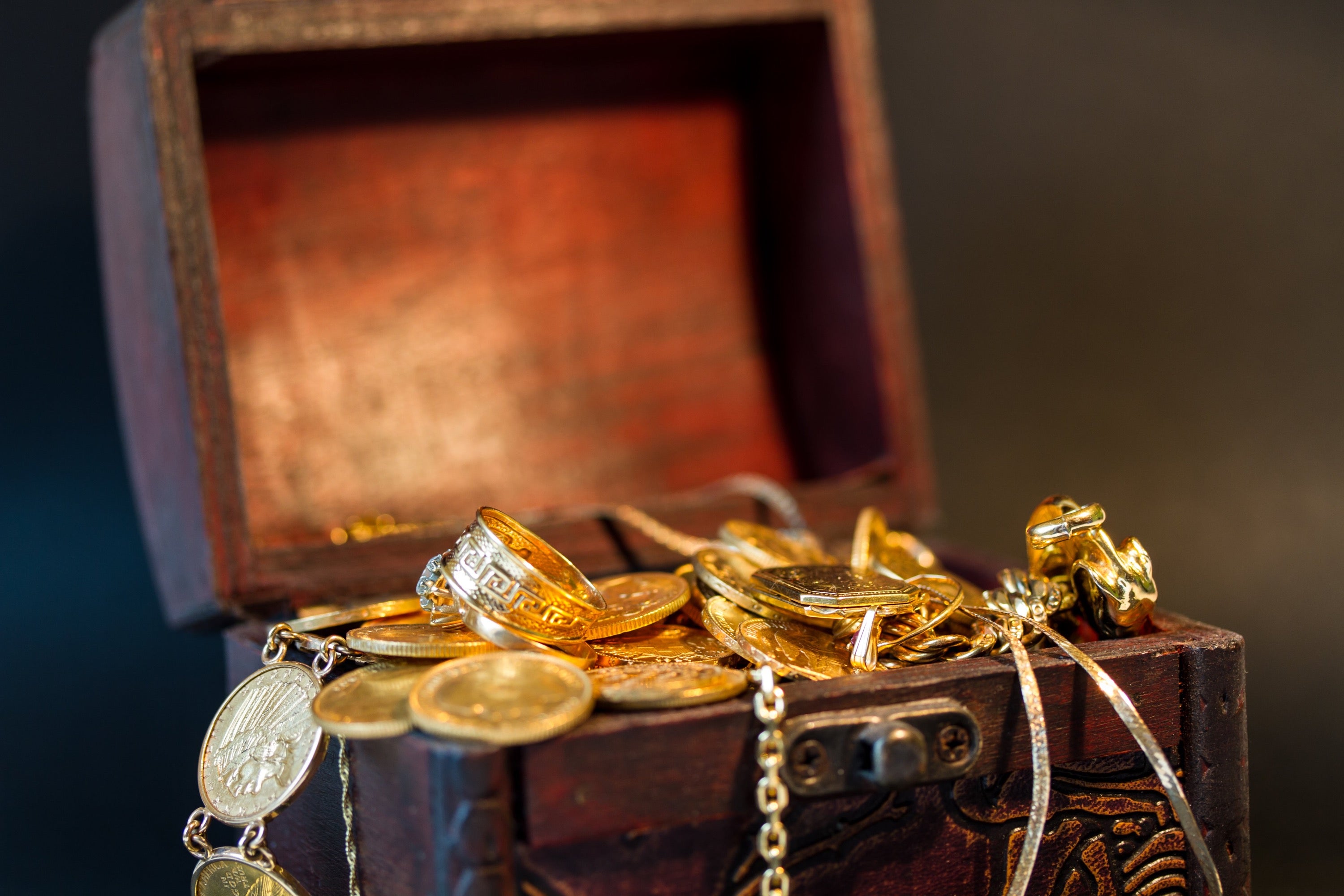 gold coins and jewelry in treasure chest