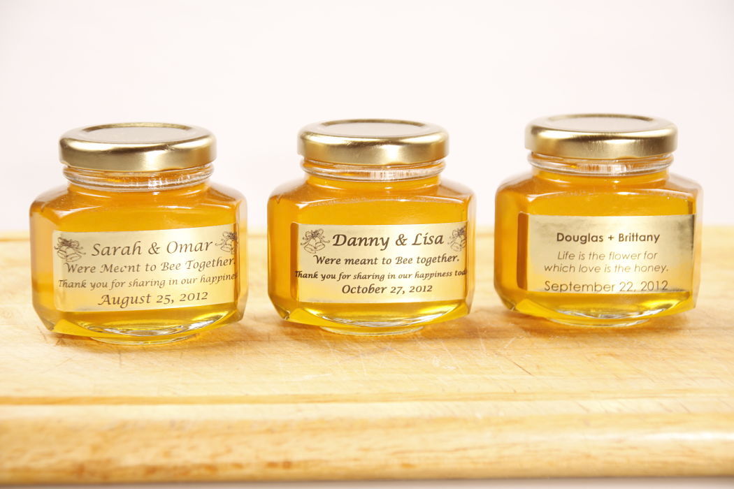 three wedding favour jars of honey