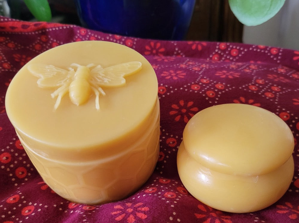 Two pure beeswax pots side by side.
