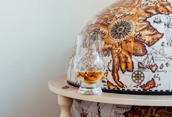 whisky-glass-on-world-globe