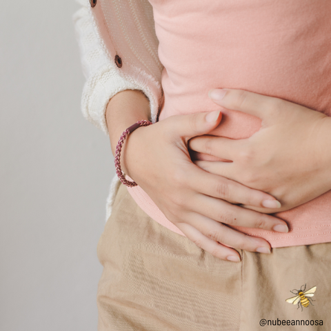 Bloating can be a symptom of digestive problems that can also cause skin breakouts.