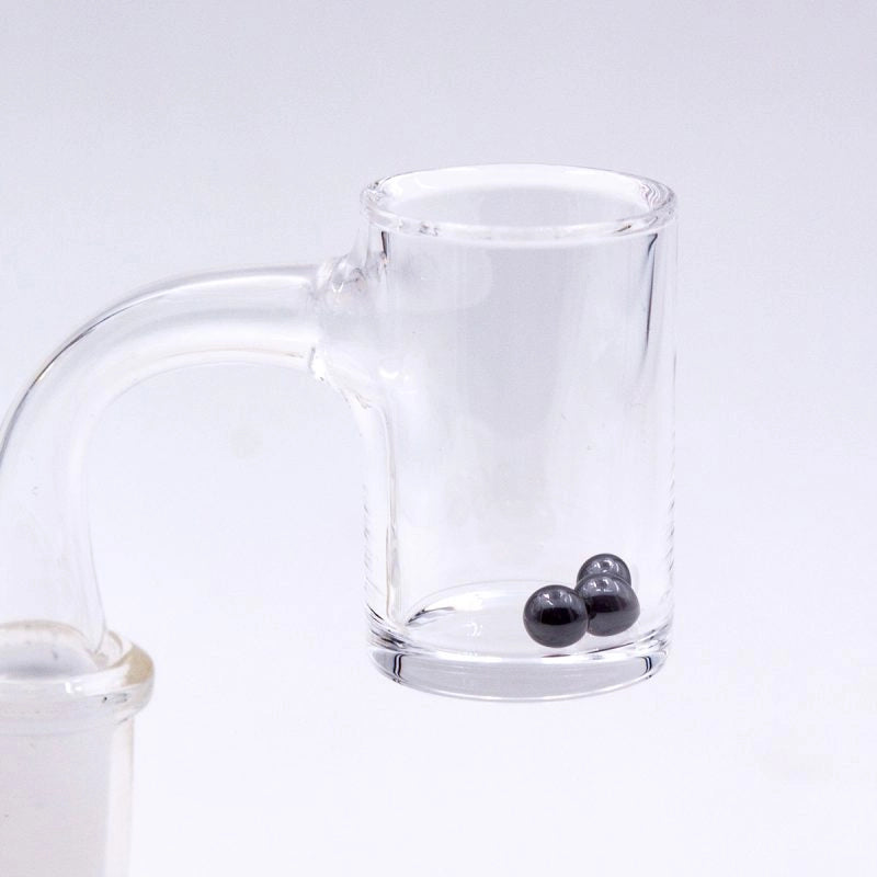 glass banger with black marbles inside