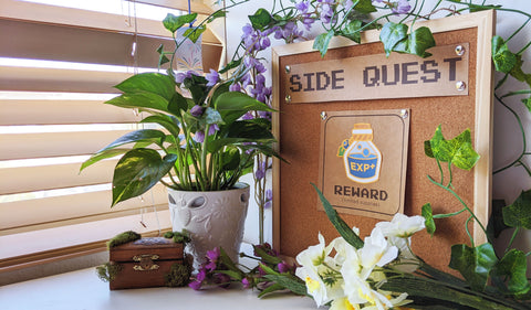 EXP Side Quest on cork board surrounded by plants