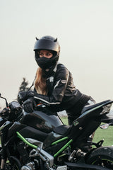 woman posing with motorcycle