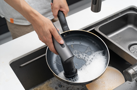 electric spin scrubber cleaning pots and pans