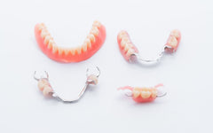 dentures on a white surface