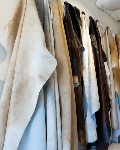 cowhide rugs hanging in Guntersville location