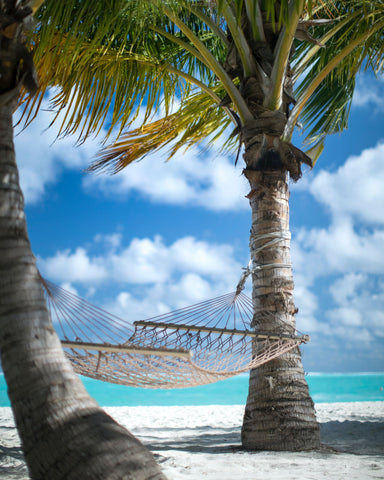 Traditional woven hammock on a beach