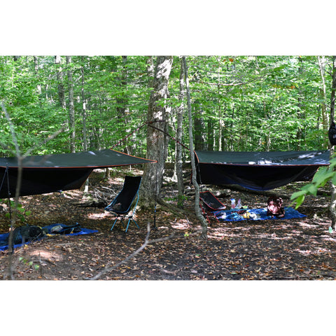 Two The Weekenders setup for backpacking with camping chairs and gear set out