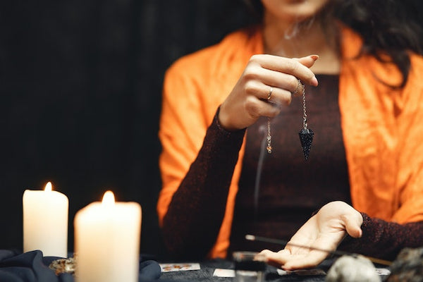 what is channeling; a woman with a pendant in her hand