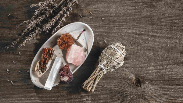 Nature-based practices, a table with crystals, sage and lavender.