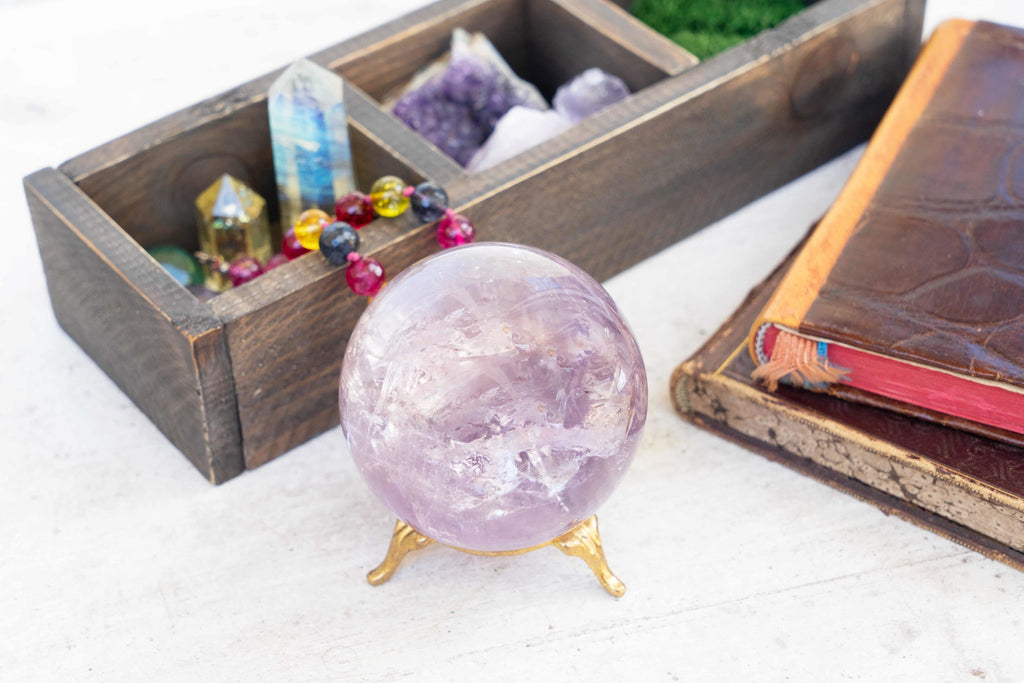 Seance tools, various types of healing crystals and a crystal ball.