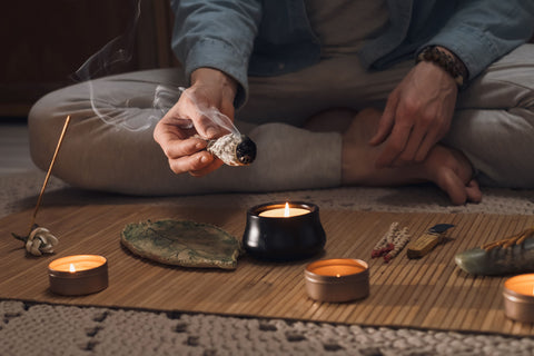 man-lighting-incense-for-meditation-and-spiritual-healing-min
