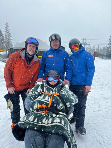 Bryan Richardson with group on ski slopes