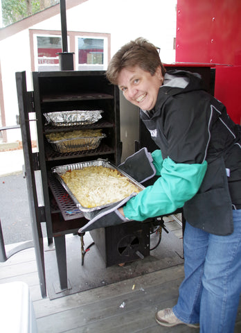 Chef Cindy Stoker manning the oven at the Atlanta Gratitude Grille Event