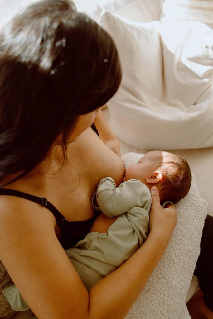 Mom breastfeeds her baby.