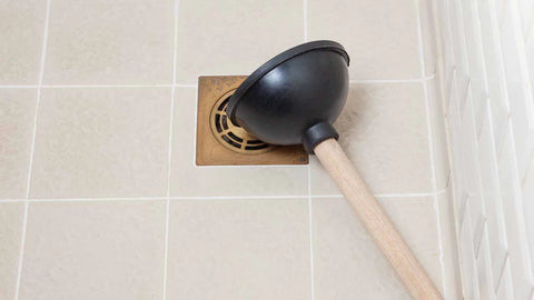 How to Unclog a Shower Drain With a Plunger