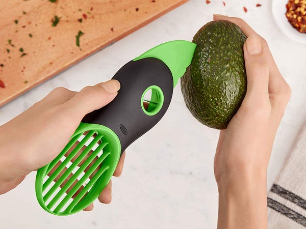 green avocado slicer and pit remover