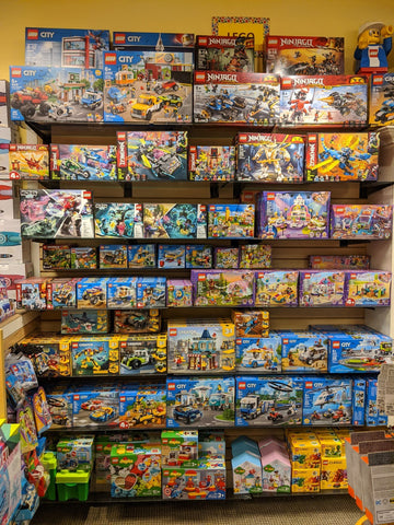 Store shelves filled with various LEGO Sets