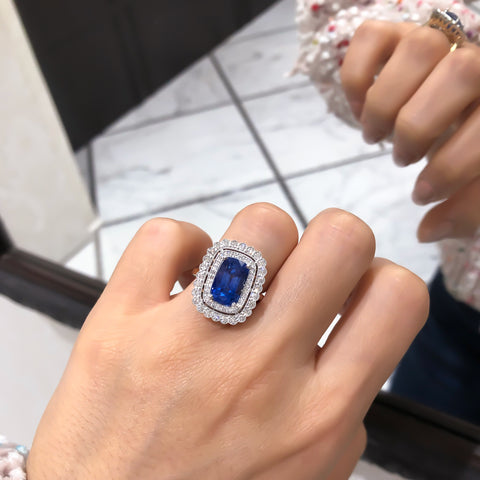 Sapphire ring with a double diamond halo