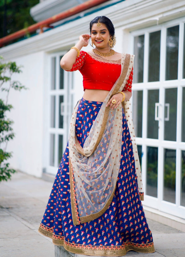 Photo of Red and Orange Lehenga with Royal Blue Blouse | Bandhani dress,  Blouse designs, Indian designer wear