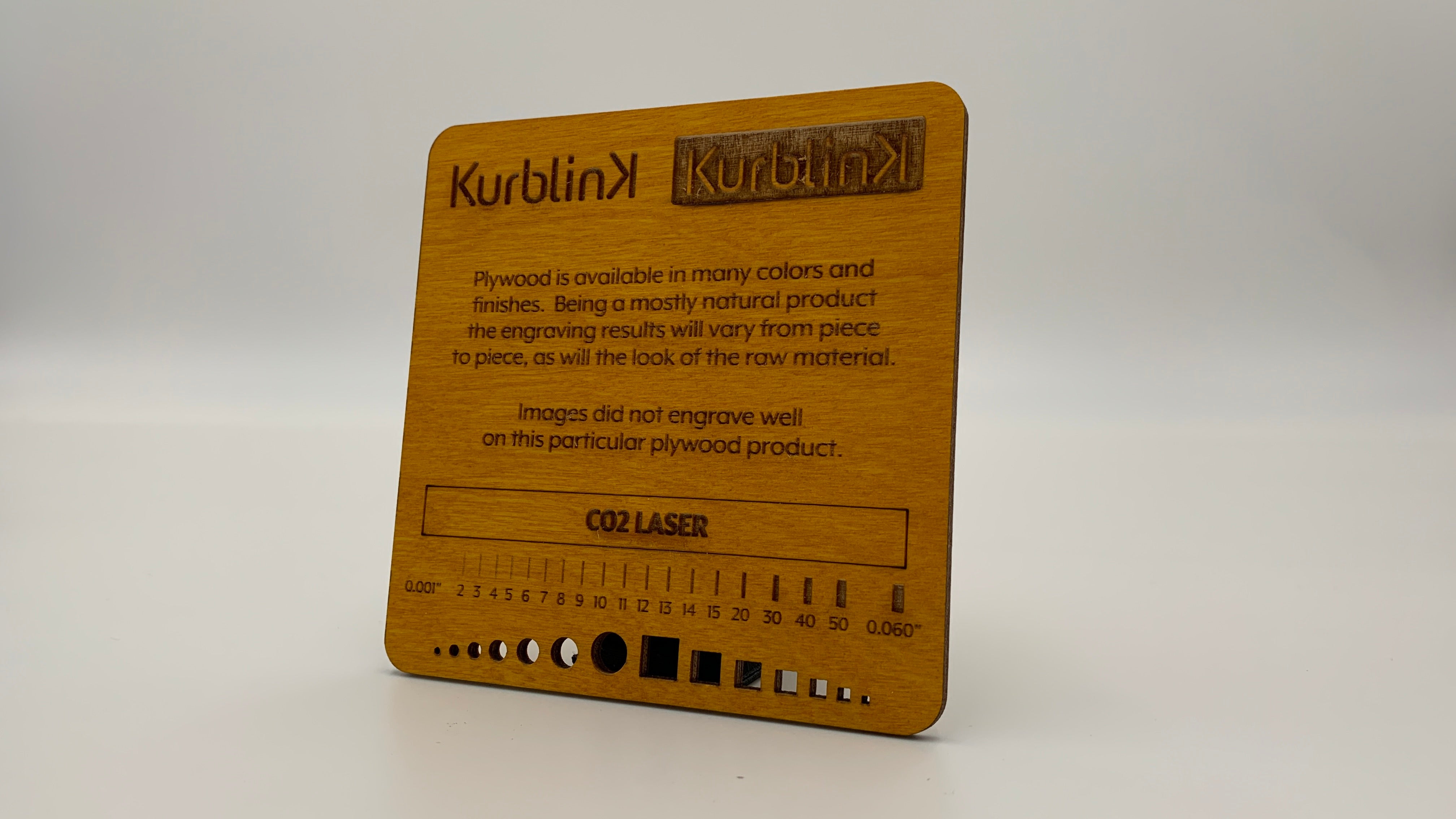 Color stained plywood laser cut and engraved by Kurblink