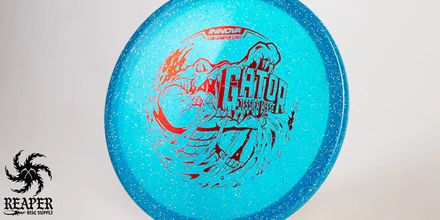 An Innova Metal Flake Gator Disc with studio lighting