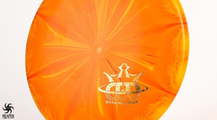 An orange Dynamic Discs EMAC Judge shot with a white background