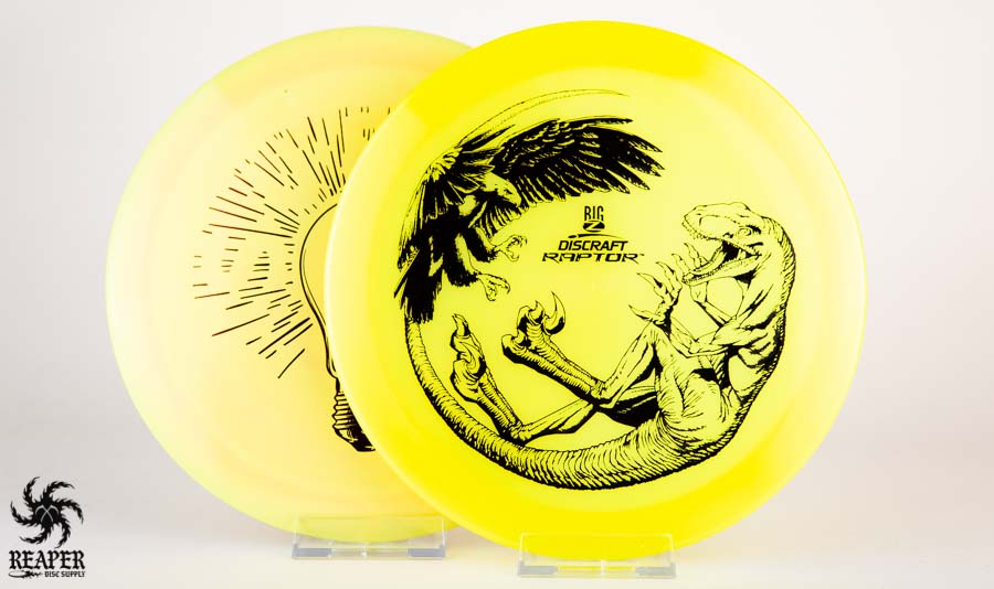 A Discraft Predator and Raptor next to eachother