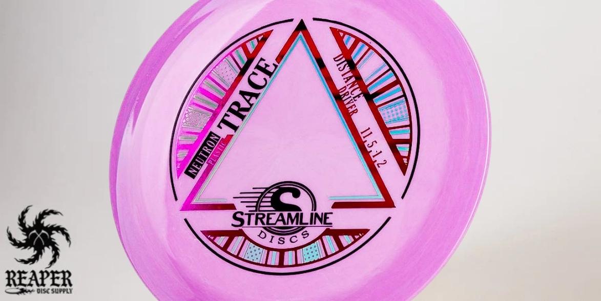 A pink Streamline Neutron Trace disc with studio lighting