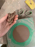 excess clay from throwing bats