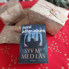 'Syv m2 med lås' af Jussi Adler-Olsen