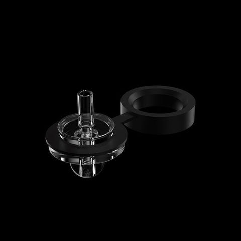 Alt text: "This is an image showcasing a component of an electric dab rig against a black backdrop. The component appears to be a transparent, glass carb cap with a cylindrical handle on top for easy lifting. Adjacent to it lies a matte black silicone band, likely used for creating an airtight seal or as a heat-resistant grip. The clarity of the glass against the dark background highlights the sleek design and functionality of the dab rig accessory.