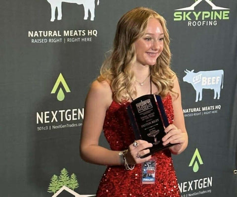Payton Riley receiving the 2023 Young Artist of the Year award from the Texas Country Music Association