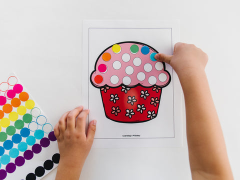 child doing the cupcake dot stickers activity for toddlers and preschoolers
