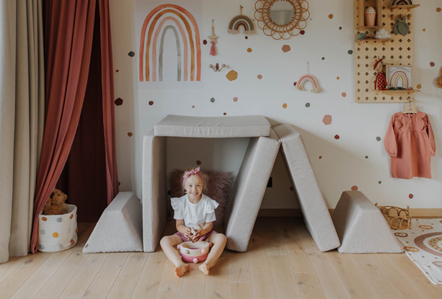 A girl sitting inside a Monboxy house