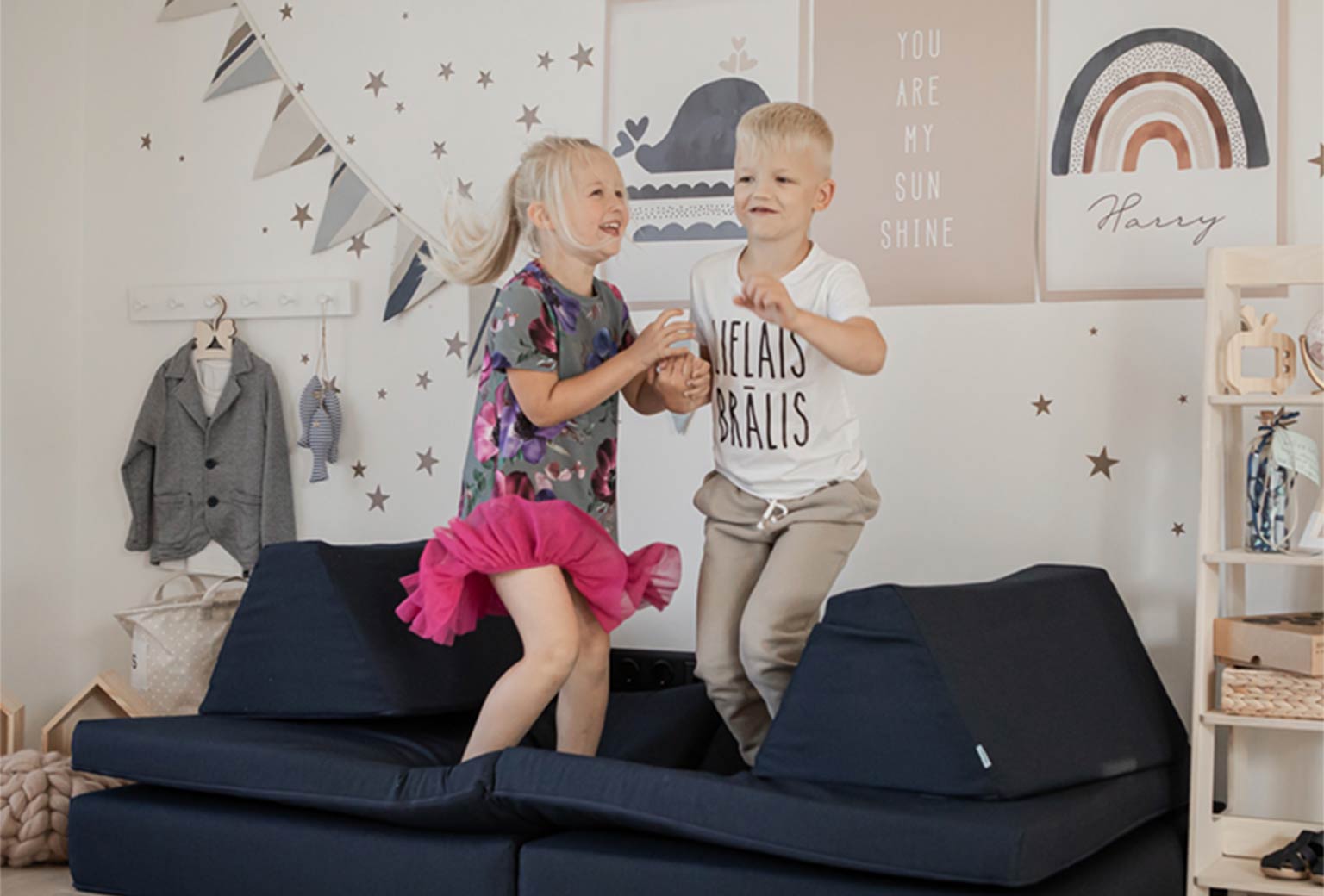 Children jumping and having fun playing with their Monboxy play sofa