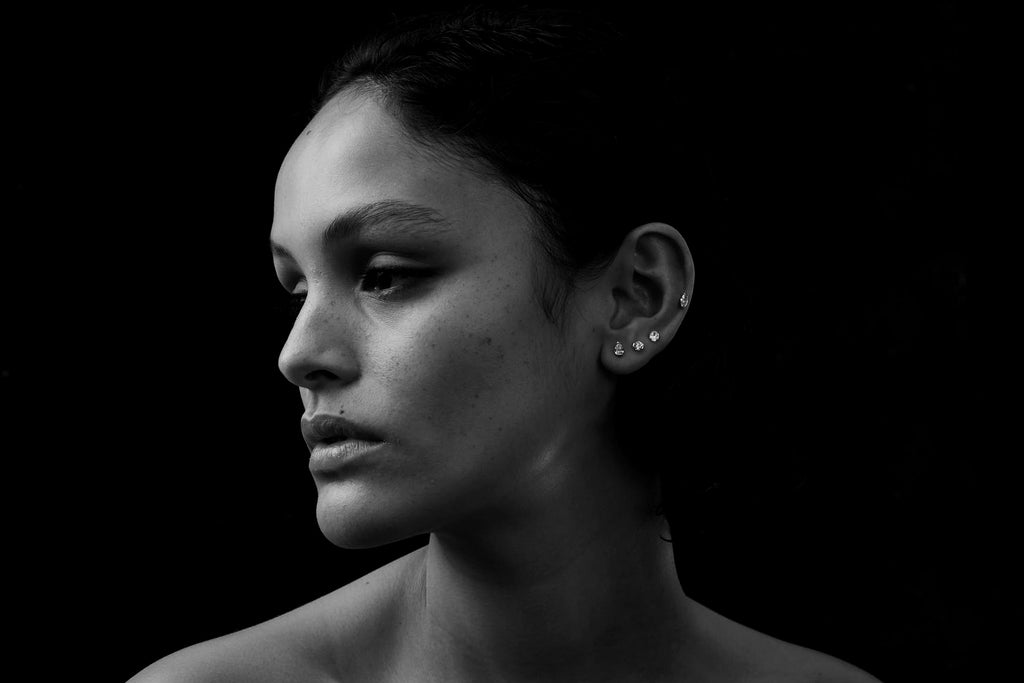 Model wears the Suspense diamond cartilage earrings by Sarah & Sebastian