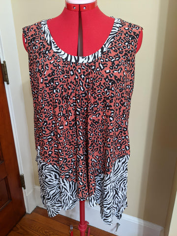 A knit top with side godets and a neckband, in contrasting tiger and zebra print fabric.