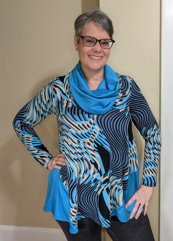 A model in a Gorgeous Godet Top with a contrasting cowl and long sleeves.