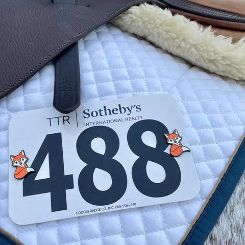 pinsnickety fox horse show number pins on a saddle pad