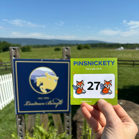 pinsnickety fox horse show number pins beside a sign for the loudoun benefit horse show where we were sponsors