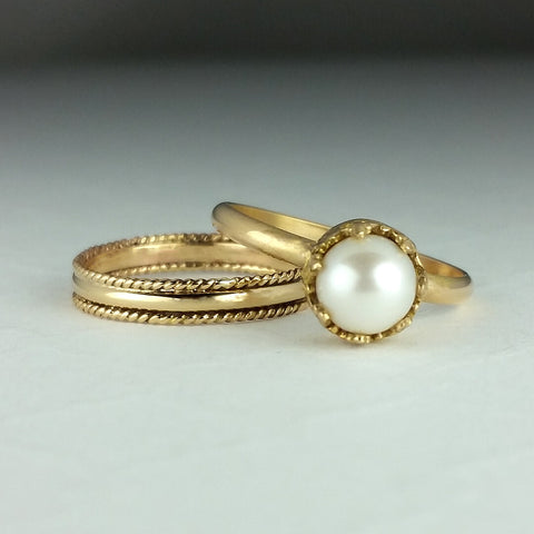 14kt gold wedding band and pearl engagement ring