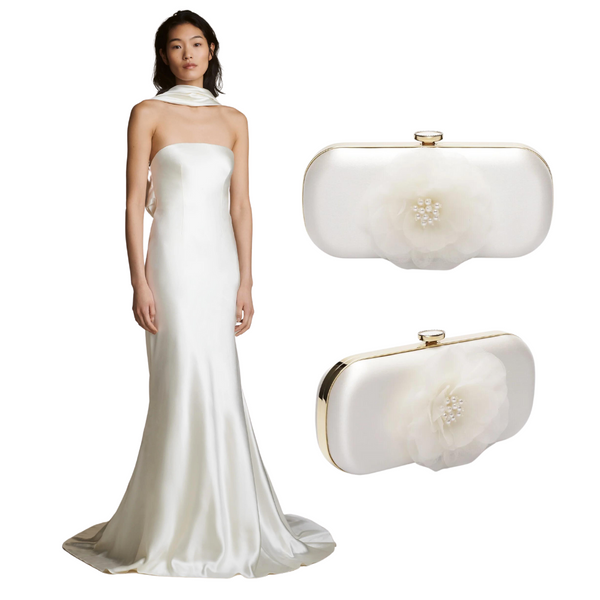Woman wearing Danielle Frankel white silk wedding dress with white clutch from Bella Rosa.