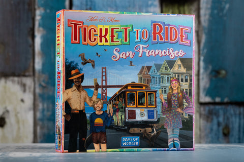 Ticket to Ride San Francisco box artwork with illustrated characters on the front in front of wooden painted boards