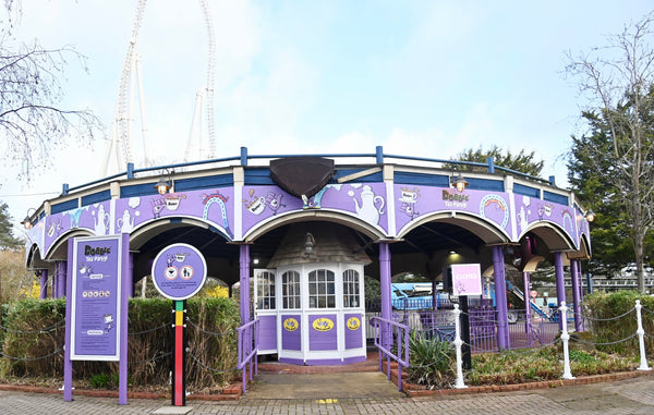 Thorpe Park tea cup ride decorated in vivid purple with Dobble branding